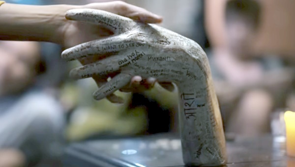 Talk To Me Whats written on the hand